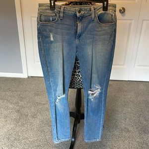 Joe”s Jeans very distressed with lots of pockets and zipper fly. Mid rise skinny